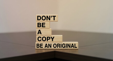 Don't be a copy, be an original inspiring message on wooden blocks for creative business and innovation - stand out and be unique