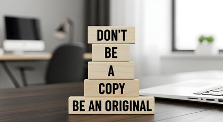 Inspiring message to be original and authentic for business success in a modern office environment with laptop and monitor