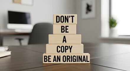 Inspiring workplace reminder don't be a copy, be an original for success in business and life on modern office desk in professional setting