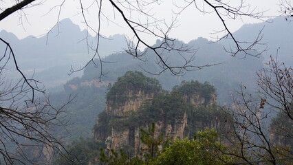 Aerial view of Zhangjiajie National Forest Park in sea of mist, Tianzi Mountain is area in the Wulingyuan Scenic Area in Zhangjiajie, Hunan Province, China