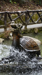 The features a statue of a Chinese dragon turtle (Longgui) fountain, This legendary creature combines the body of a turtle with a dragon's head, symbol of Chinese mythology and culture in China
