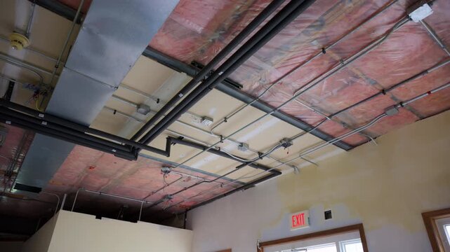  hvac heating, ventilation, air conditioning systems under ceiling in empty room in residential house under renovation process