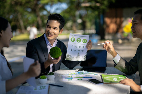 Business people discussing esg environmental social governance outdoors