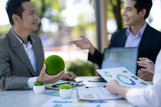 Businessmen discussing esg sustainability meeting green environment strategy