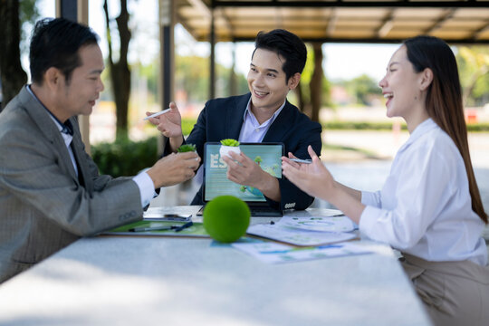 Business colleagues discussing environmental social governance esg outdoors