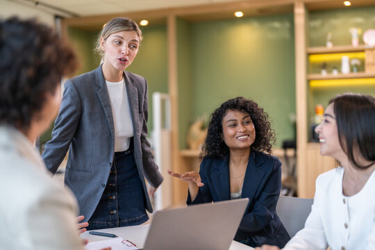 Leadership training, executive communication and team development in progress with diverse professionals in coaching seminar, strategic thinking and interpersonal skills in a modern workplace