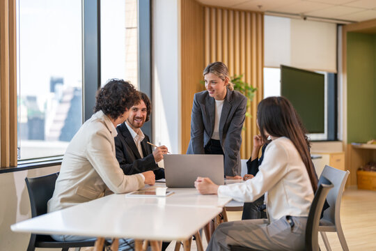 Leadership training, executive communication and team development in progress with diverse professionals in coaching seminar, strategic thinking and interpersonal skills in a modern workplace