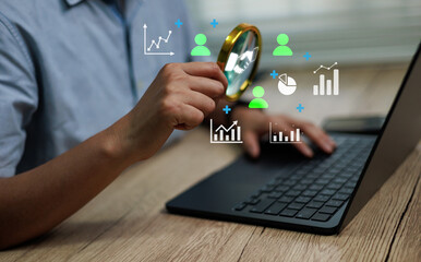 Business analytics concept showing a person using laptop with magnifying glass and digital charts, symbolizing data analysis, marketing procurement insights, performance optimization