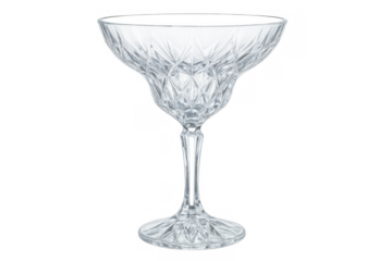Elegant crystal coupe glass with elaborate cut pattern, ready for cocktails or champagne on a transparent background