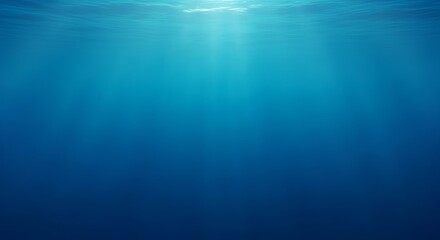 A tranquil underwater scene with rays of sunlight filtering through the deep blue ocean, creating a serene and ethereal background