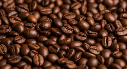 Fototapeta premium Close-up of roasted coffee beans — aromatic Arabica texture background for coffee lovers