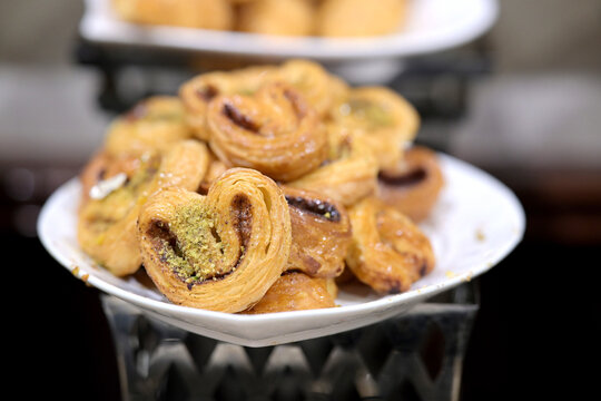 Sweet palmiers dusted with pistachios, a delightful treat