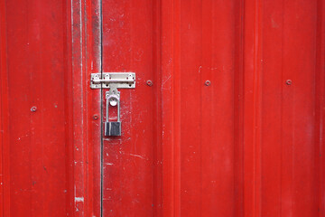 Secure red door with padlock for safety concept