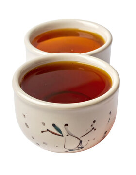 Traditional ethiopian tej mead in a rustic jug, a fermented honey drink with spices, professionally isolated on a white background