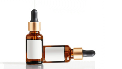 amber glass essential oil bottle with dropper cap, soft light reflections, minimal spa aesthetic, clean label space, isolated on transparent background.
