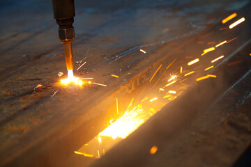 Flame Cutter Cutting Through a Steel Plate