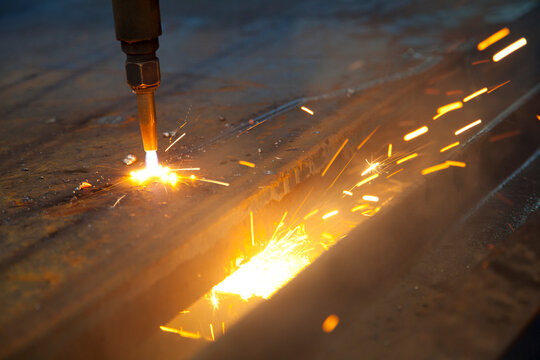 Flame Cutter Cutting Through a Steel Plate