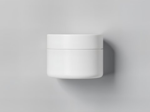 A minimalist, overhead shot of a short, wide White Plastic Cosmetic Jar with a matte finish and a tight-fitting flat lid