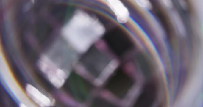 Blur beam prism. Light swirling. Colorful arch ring flash in silver glass stroboscopic ball. Abstract spectrum twinkle art background.