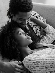 Intimate black and white portrait of African American couple embracing tenderly, sharing loving gaze in cozy indoor setting. Generative AI.