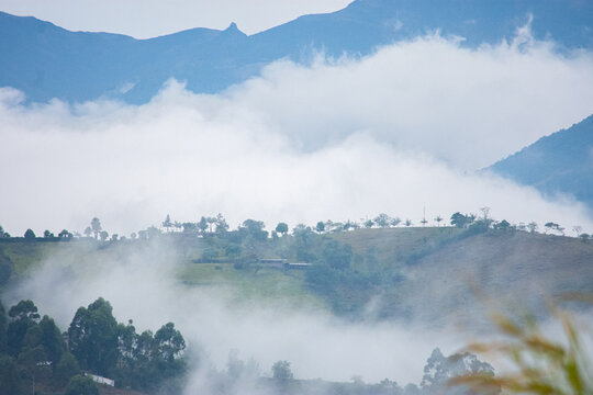 Breathtaking view of fog-covered mountains and valleys in Popay&aacute;n, Cauca, Colombia, showcasing serene nature and stunning landscapes.