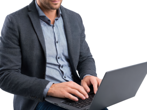 Professional man typing on laptop in office.