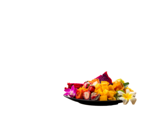 A vibrant black plate holds a colorful assortment of fresh, tropical fruits, including dragon fruit, mango, and strawberries
