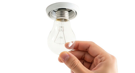 A hand holding a clear light bulb against a greenscreen