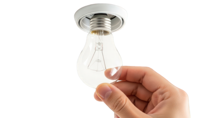 A hand holding a clear light bulb against a greenscreen
