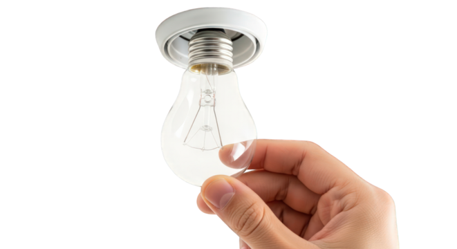 A hand holding a clear light bulb against a greenscreen
