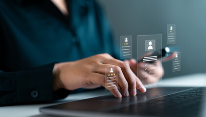 Businesswoman using laptop and smartphone reviewing resumes with holographic profiles. Digital recruitment, talent selection, online HR management and employee performance evaluation system concept.