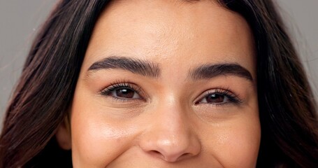 Obraz premium Portrait, woman and eyes in studio with microblading, eyelash extension and skincare for beauty. Female person, lash lift and eyebrow transformation for makeup aesthetic, wellness and dermatology.