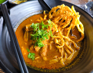 Close-Up of Khao Soi in Black Bowl. thai food