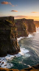 Dramatic cliffs of moher at sunset with crashing waves