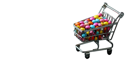 A small shopping cart overflowing with colorful, candy-coated chocolates against a black backdrop