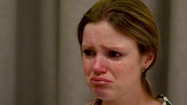 Emotional crying caucasian woman confront cheating partner, face close-up