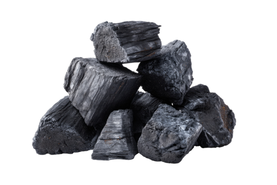 A pile of charcoal chunks against a black backdrop, showcasing the texture and form