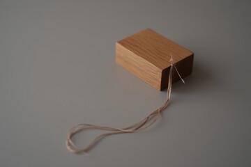 Small cardboard box with string and metal clasp