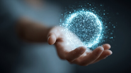 Woman's hand interacting with a levitating glowing data sphere emitting light and digital particles representing technology, innovation, futuristic interface, data visualization, and modern digital in