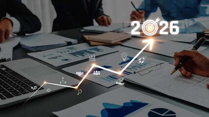 A dynamic business meeting showcasing growth strategy and data visualization for 2026. The image captures teamwork and planning, emphasizing future success through effective collaboration. Raster - Powered by Adobe