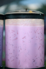 Refreshing pink drink with ice, perfect for summer refreshment