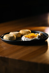 Macro of homemade cheesecakes with peach topping and cream