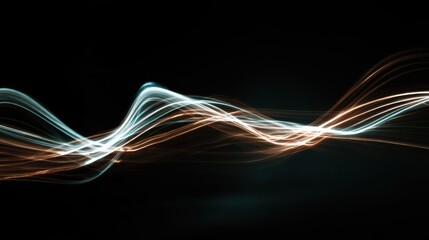 Abstract luminous light streaks in blue and orange forming dynamic wavy lines on black energy flow