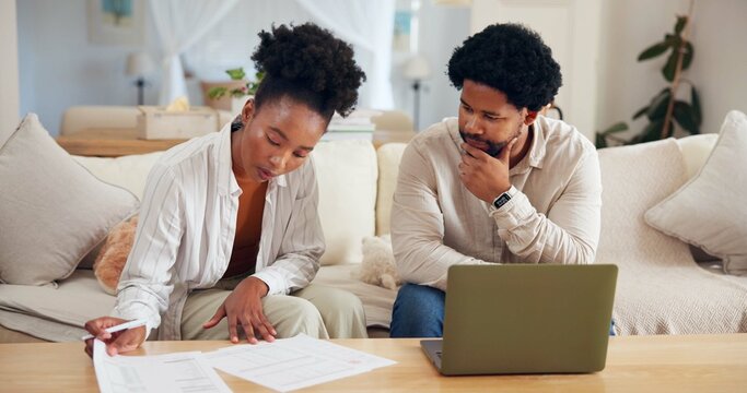 Finance, documents and laptop with black couple on sofa in living room of home for budget review. Computer, financial planning and thinking with African people in apartment for investment or wealth