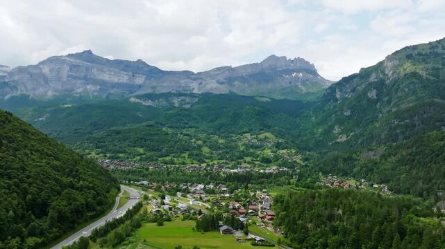 Drone tilting over the Servoz village, overcast, summer day in Alps, France