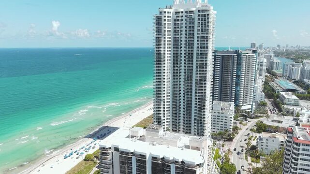 Miami Beach, Florida USA, Revealing Drone Shot of Beachfront Condominium Towers and Sandy Shore