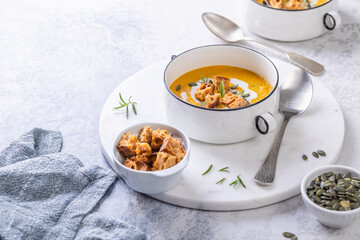 Pumpkin soup with homemade fresh sourdough croutons, comfort autumn dinner balanced food