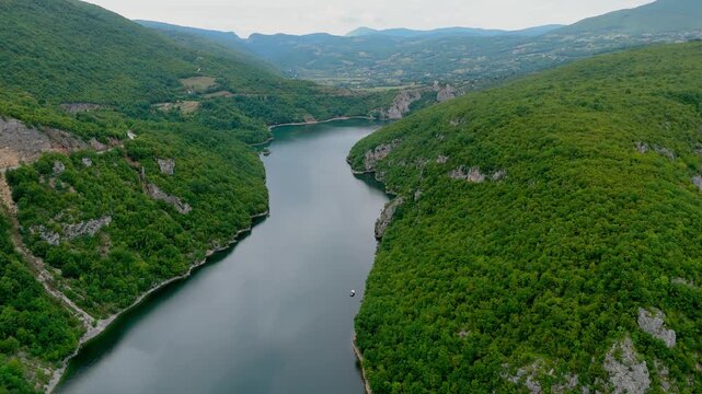 Aerial drone wide angle view of the Vrbas River in Bosnia and Herzegovina, flowing through green canyons and rocky cliffs