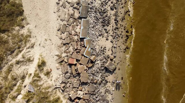 Amazing drone footage in zenithal view of the beaches of Dunkirk, France. Revealing the forgotten WWII bunkers completely destroyed and the brown sea.