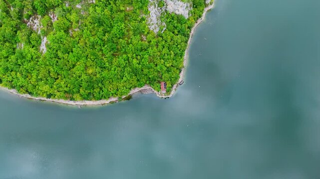 Aerial drone top down view of the Vrbas River in Bosnia and Herzegovina, flowing through green canyons and rocky cliffs a popular destination for rafting and nature travel